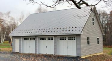 Pole building with vinyl siding and metal roof in Burlington, CT