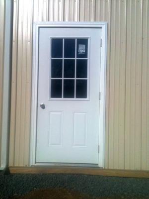 Residential style entry door with window